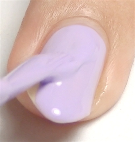 Paint your middle and accent nails with a lilac nail polish