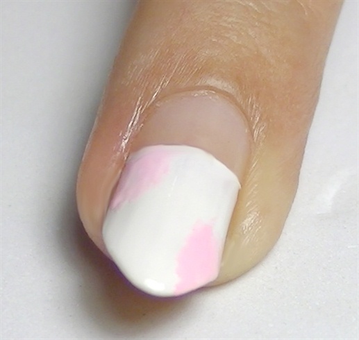 With a soft pink nail polish, paint the base for the roses