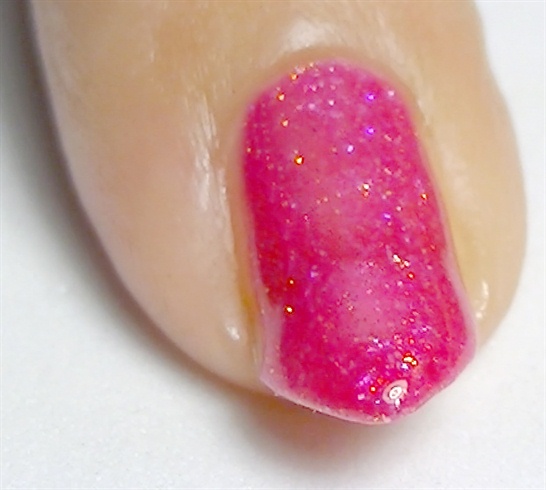 Apply base coat then paint your nails with a fuchsia glitter nail polish