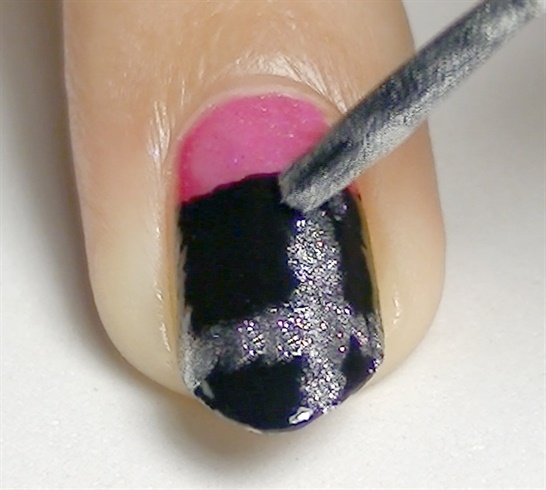 Let it dry and using a silver nail polish, paint an abstract vertical line and then a horizontal one