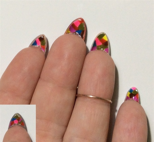 on the lower surface of the nails I created a cubic abstract design to imitate Picasso's cubic style.I used soak off gel polish and acrylic paints.
