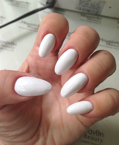 Apply two coats of opaque white gel polish to create a canvas for the colours to pop.