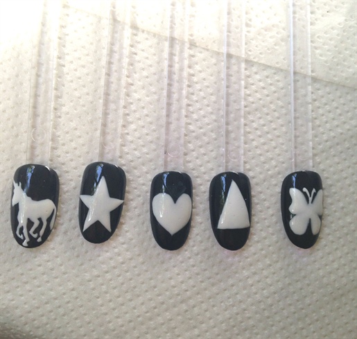 freehand painted designs with opaque white gel polish (and cured)