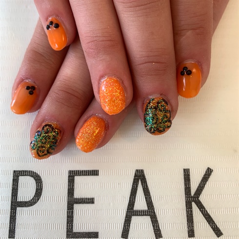Orange Nails With Black Bling