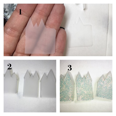 1. Cut out village scene house pieces from cured matte gel. You’ll need two of each piece so that your houses are 3D on all sides…not like they’ve come from a cookie cutter. I’ll provide a link for the pattern I modified in the comment section.  2. Glue pieces together.  3. Coat with no cleanse top coat and sprinkle with glitter, cure.