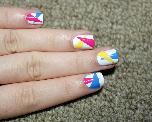 Stick the polish triangles to your nails.