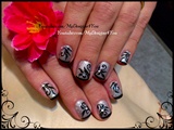 Black and silver floral nails. 