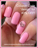 Pink nails with heart nail charm. 