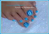 Blue floral toenail art