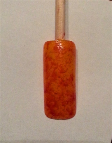 Orange for the base and a translucent brownish sponged on top. 