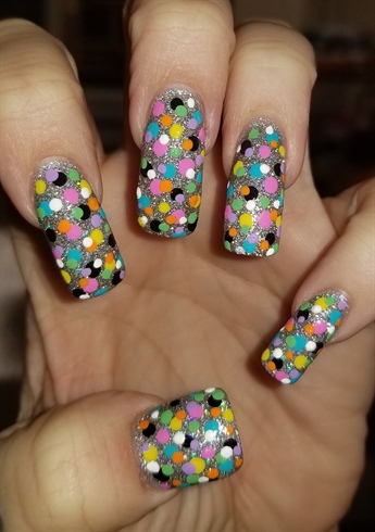 Multi colored dots on glitter background