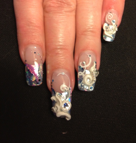 Prep and apply tip to nail.  Using any medium you prefer, encase foil and sequins inside.