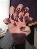 glittery nails with striking nail art