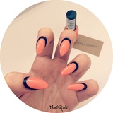 coral on black ruffian style nails