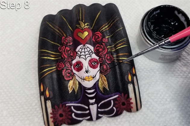 Add any final touch-ups and small details using gel paint and a fine nail art brush, curing in a UV lamp as you work, to prevent smudging the image.