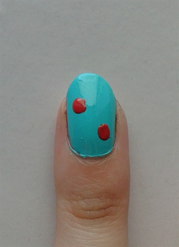 Then, using a dotting tool, and Rimmels 'Coralicious', create 2 dots on your nail. 