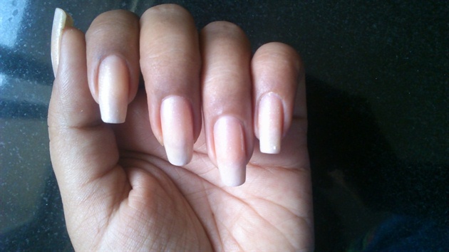 two coats of a sheer polish nd one coat of a clear glitter polish to create nude nails