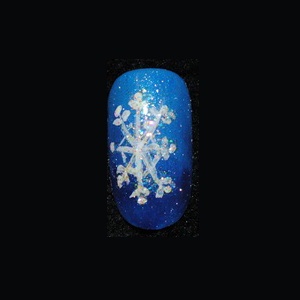 Place a drop of Entity Gel Enamel Top Coat on a pallet. Dip a detail brush into the top coat, then into Eye Kandy glitter in #41 Marshmallow S. Apply the glitter with the brush over the snowflake to add accent. Cure.