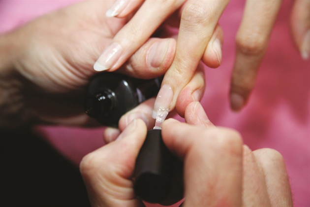Smooth the surface and add strength by applying a layer of clear soak-off gel-polish. Cure.