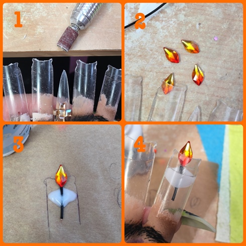 I wanted to make the flames look as though they were inside the glass of the candles which meant applying them from behind, Simply gluing them on from behind looked messy and caused the clear tips to fog up from the glue fumes so I applied small pieces of wire to the back of the crystals in the form of a candle wick and fixed them in place using a small bead of acrylic.