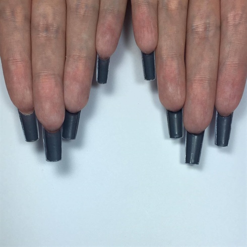 I painted two coats of dark grey gel underneath the nails, remembering to cure in between for 30 seconds. The reason I used dark grey is because i feel it represents a depressed mood. When you are sad, you feel grey. 