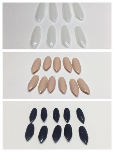 Using size 10 and size 8 of an oval nail tip, I cut one end of the top into a point and then I buffed the surface of the nail. Using a cream gel polish, I applied two coats and cured each layer for 30 seconds. I also applied 'non-sticky' top coats and left the petals to be assembled on the tips at a later stage.