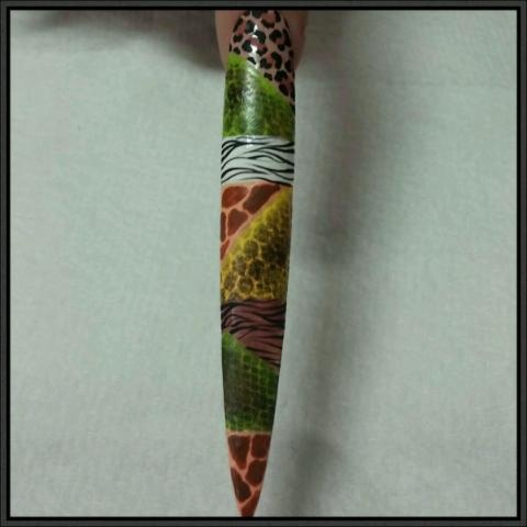 step 5 safari continue to design nail with zebra stripes using a nail art liner\n\nuse a dotting to create tiny smudges for giraffe\n\nuse a dotting tool to make tiny smudges for cheetah then go around the smudges with dotting tool using black acrylic paint \n\nlet dry