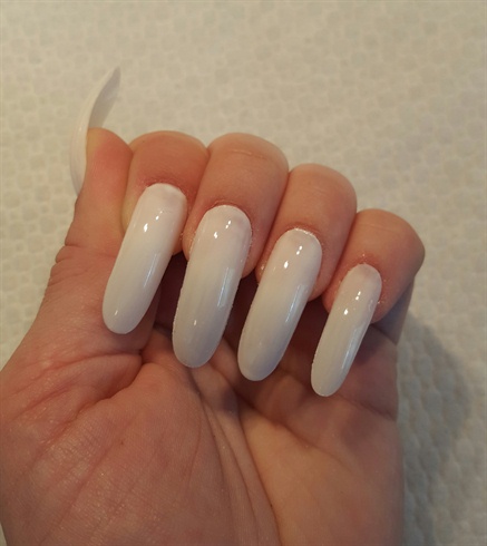 First, I sized the nails, shaped them and applied 2 coats of white polish. 