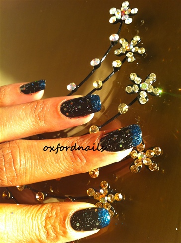 black with blue sparkly french tips 