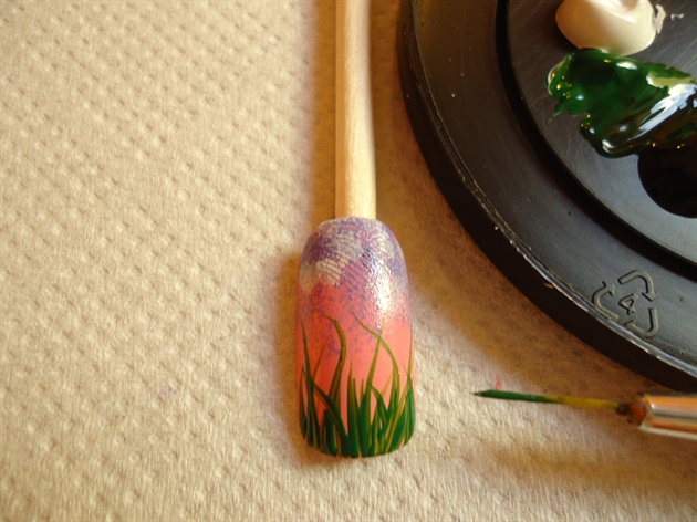 With a dark green acrylic paint and a striper brush create the plants´ branches begining from the very tip of the nail.Some of them must be longer and others shorter -all of them looking in different directions.