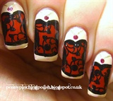 Red and black front corset nail art