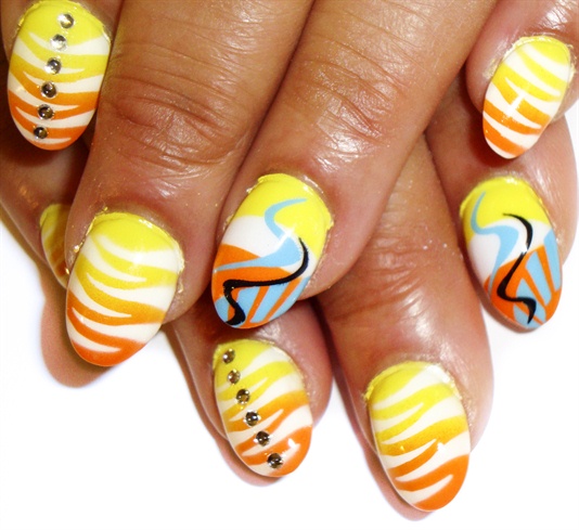 yellow an orange tiger nails