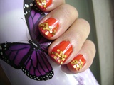 red and gold glitter nails