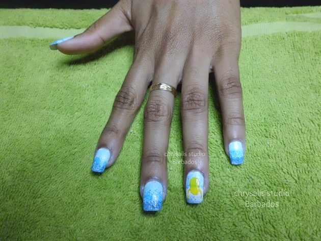 additional blues. Use a kiss nail art brush to do outline and fill minion's head and arms