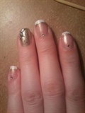 French manicure with gold accents