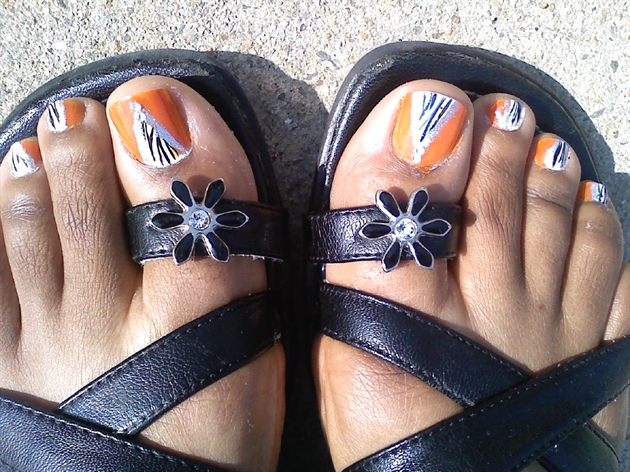 Zebra and orange on my toes, lol