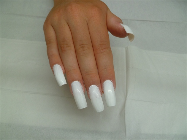 The nails were painted with acrylic paint, I started with white to create a blank canvas.
