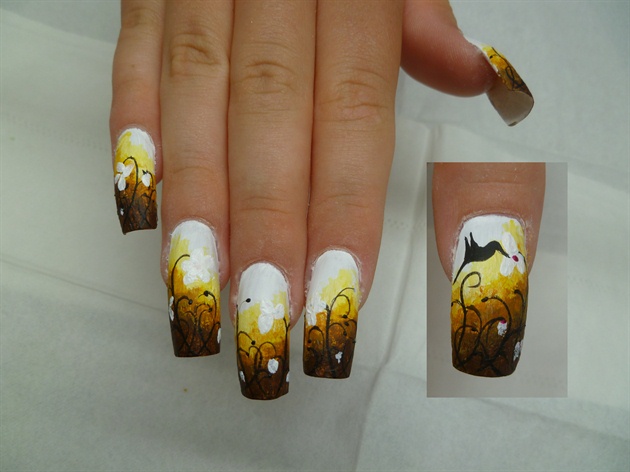 Then the petals, the hummingbird on the thumb and the final dots for the centre of the daisies.