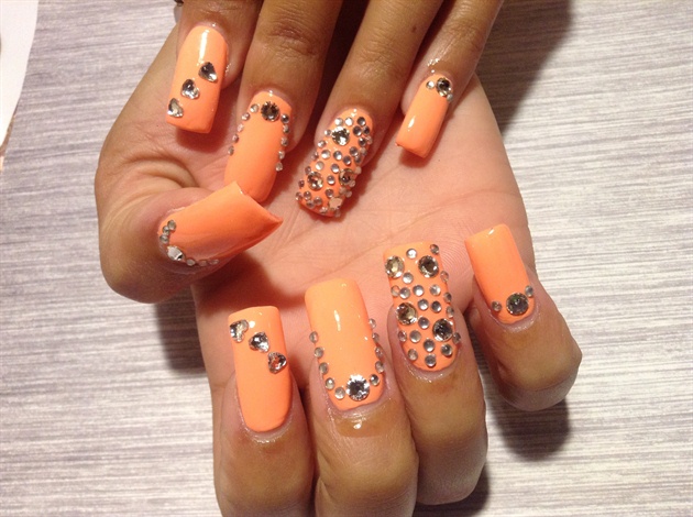 Orange nails with rhinestones