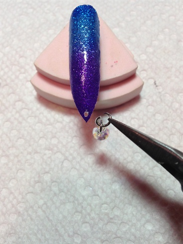 Paint with glitter polishes then uv top coat. Put jewelry on.