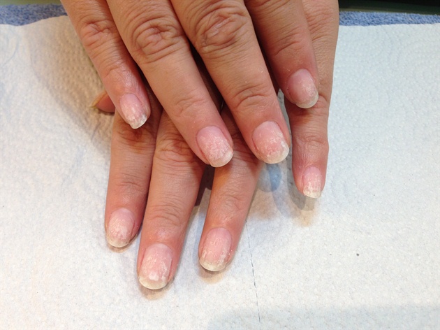 File natural nails round, trim cuticles and prep.\n