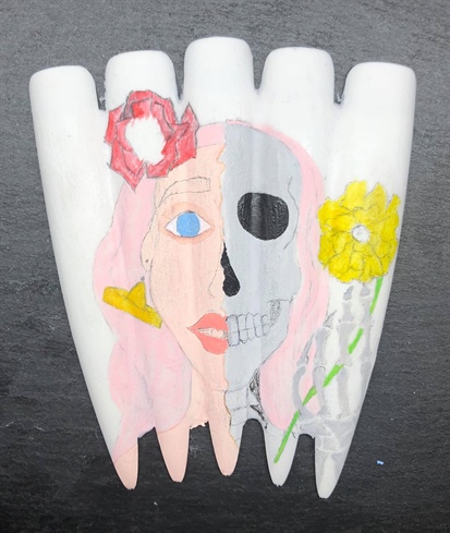 I then went onto adding more colour to my design such as the flowers, eye & lip colour, the hair and also to the hand bones. I then allowed time for my paints to dry.
