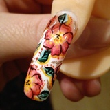 floral nail design on acrylic nail