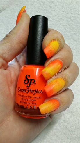 Using yellow acrylic paint, sponge nails, alternating between the top and bottom of the nails to give a uneven appearance. Apply Matte Top Coat and allow to dry.