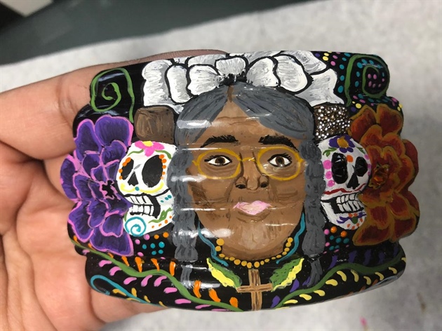 I finished up my design by adding another white flower, my candle, colorful Mexican inspired embroidery, and my Grandma's cross necklace.