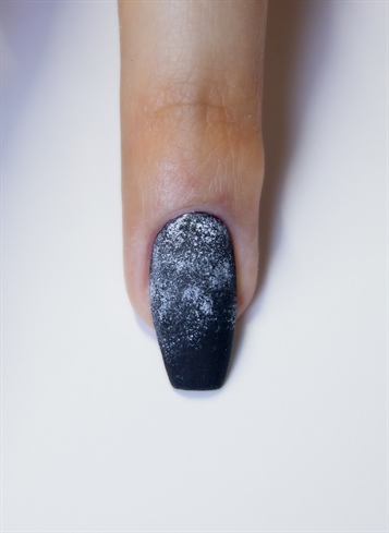 Apply two coats of black gel-polish and cure each coat. Apply matte top coat and cure. With a makeup sponge, apply white and gray acrylic paint in order to give the background a dirty look.
