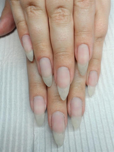 Prep natural nails- remove shine, and push back cuticles.