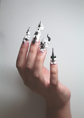 This is my finished product, I added different lighting to enhance the angles of the decor and show depth in the nail art