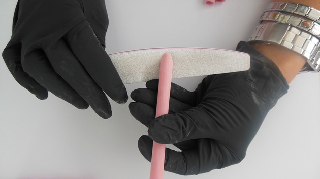 Shorten the gel tubes using a 180 grit file. File the bottom part of the gel tube at an angle to ensure that these mirror the shape of the cuticle and slide onto the fingers easily.