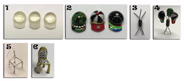 Souvenirs. 1. Create caps with big beads of LED builder gel. Cure. Create the peak of the cap with a thinner layer of LED builder gel. 2. Decorate the caps with gel polish, bullions and rhinestones. 3. Create a cap stand using three pieces of metal wire held together with a wire bead and LED builder gel. 4. Hold the caps in place on the cap holder with a bead of LED builder gel. 5. The chair structure is created with metal wire that is then dipped into white LED builder gel. 6. The cushions on the chairs are created by using beads of LED builder gel and the chair is decorated using gel polish for a real African feel.